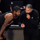 Paul George with Clippers head coach Tyronn Lue.